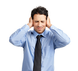 Image showing Businessman covering his ears for noise in a studio for stress, headache or frustration. Corporate, upset and professional male employee preventing sound during a migraine by a white background.