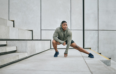 Image showing Stretching, black man in the city for fitness, body training and morning motivation in New Zealand. Warm up, health exercise and African runner thinking of outdoor cardio workout idea