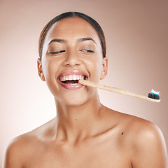 Image showing Fun woman, face or toothbrush on studio background in dental care, hygiene grooming or mouth healthcare. Happy smile, beauty model and toothpaste product for brushing teeth or oral cleaning wellness