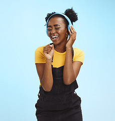 Image showing Music, dance and freedom with black woman and headphones, singing for relax, celebration and streaming. Audio, smile and technology with girl listening to online radio for playlist, energy and happy