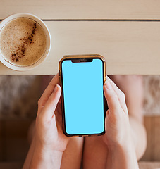 Image showing Coffee, phone and hands of girl with green screen mock up at home to relax with online app zoom. Streaming, social media or news advertising screen with smartphone and drink of woman on internet