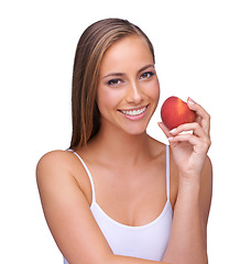 Image showing Red apple and woman with teeth health isolated on white background for natural, wellness and dental advertising. Beauty, model portrait and hand holding fruit for teeth whitening results in studio