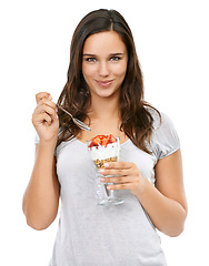 Image showing Portrait, diet and nutrition with a woman in studio isolated on a white background while eating muesli for weightloss. Breakfast, health and food with a beautiful young female enjoying a snack