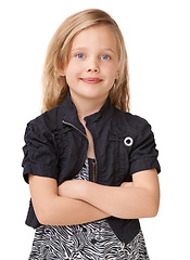 Image showing Arms crossed, smile and portrait of a girl for fashion on a white background in studio. Stylish, fashionable and headshot of a child model with pride, confidence and happiness on a studio background
