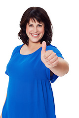 Image showing Portrait, woman and thumbs up for achievement, success and confident female isolated on white studio background. Mature lady, smile and hand for solidarity, positive reaction and support for decision