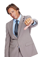 Image showing Businessman, thumbs down and bad news, disappointment or failure against a white studio background. Portrait of a isolated business man pointing down thumbs in disapproval, wrong or incorrect gesture