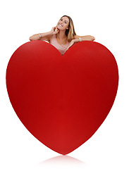 Image showing Heart, in love and woman happy with freedom and funny excited feeling behind sign. Model, white background and comic young person with happiness, joy and smile for romance and beauty isolated