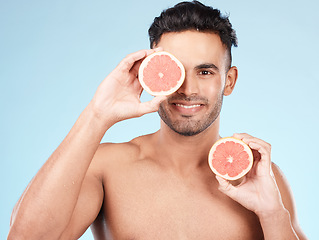 Image showing Beauty, health and portrait of man with grapefruit for fruit detox, healthy body or natural facial skincare routine. Wellness spa salon, vitamin c glow and happy nutritionist model with food product