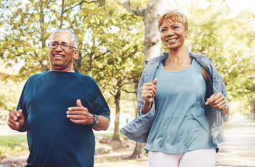 Image showing Senior runner couple, park and fitness with smile, teamwork or motivation for wellness in summer sunshine. Happy elderly man, woman and running team by trees for exercise, health or outdoor workout