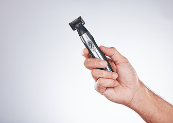 Image showing Hand, razor and hair removal with beauty and man with grooming mockup, hygiene and body hair care against studio background. Shaving, electric shaver and cosmetic tools product with face care