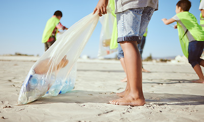 Image showing Children, legs or plastic bottles in beach clean up, climate change collection or environment sustainability recycling. Kids, diversity or students in cleaning waste management or community service