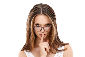 Image showing Woman, secret and finger on lips for portrait, quiet and whisper hand gesture with glasses in white background. Model, face and silence hands for hush expression or peekaboo eyes isolated in studio