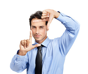 Image showing Hands, frame and portrait of business man on studio background for profile picture. Face, worker and finger framing for perspective, professional selfie and vision of planning, goals and inspiration