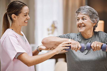 Image showing Women, senior or physiotherapy help with dumbbell in wellness clinic, healthcare center or nursing home living room. Smile, happy or physiotherapist nurse and elderly patient in weight rehabilitation