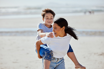 Image showing Mother, beach piggyback and asian child with smile, family bonding and outdoor vacation in sunshine. Happy family, interracial and ride on woman back for adoption, love and game by ocean for holiday