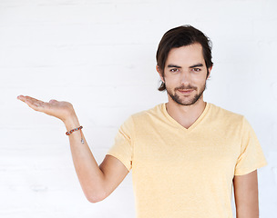 Image showing Mockup gesture, studio portrait and man with sales promotion, luxury present gift or discount deal mock up. Marketing space, product placement or advertising model isolated on white background wall