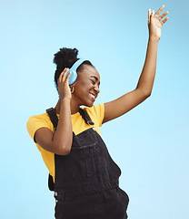 Image showing Music, dance and freedom with black woman and headphones feeling celebration, relax and streaming. Audio, smile and technology with girl listening to online radio for playlist, energy and happy