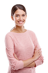 Image showing Portrait, fashion and smile with a model woman in studio isolated on a white background standing arms crossed. Marketing, blank space or style with a young attractive female posing to promote clothes