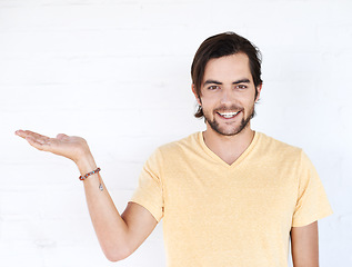 Image showing Mockup gesture, studio portrait and happy man with sales promo, luxury present gift or discount deal mock up. Marketing space, product placement or advertising model isolated on white background wall