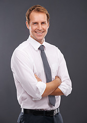 Image showing Corporate, leader and management portrait of man with optimistic career mindset and happy smile. Professional businessman smiling with happiness and arms crossed at isolated gray background.