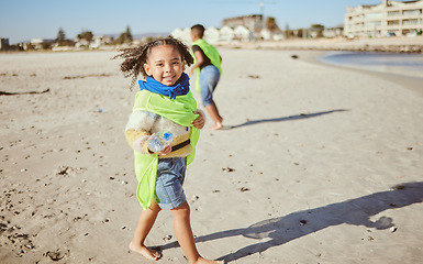 Image showing Plastic, beach and child recycling in portrait for earth day, ocean and environment cleaning education, learning and volunteer support at ngo. Recycle, community and girl with bottle for kid project