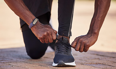 Image showing Workout shoes, running and black man runner with fitness outdoor, hands and start run, healthy lifestyle and athlete with sport. Exercise, sneakers and body training with sports motivation and cardio