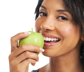 Image showing Apple, teeth and woman eating in studio for health, wellness and vegan diet with food or fruits promotion. Healthcare, self care and black woman with fruit choice for nutrition in a portrait smile