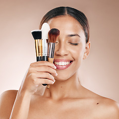 Image showing Makeup, tools and brush with face and woman, beauty cosmetics and wellness against studio background. Facial, treatment and cosmetic equipment, smile and microblading with skincare mockup