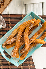 Image showing Traditional churros with hot chocolate 