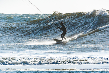 Image showing Kitesurfer riding ocean waves