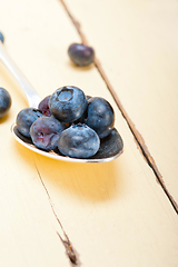 Image showing fresh blueberry on silver spoon