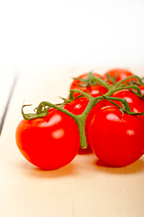 Image showing fresh cherry tomatoes on a cluster