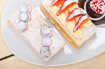 Image showing selection of fresh cream cake dessert plate