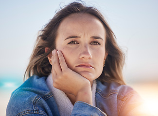 Image showing Sad, thinking and depression with woman at beach feeling stress, exhausted and problems. Mental health, crisis and anxiety with face of girl alone with frustrated, worry and confused by the sea