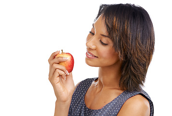 Image showing Health, fruit or black woman eating an apple in studio on white background with marketing mockup space. Smile, organic or happy African girl advertising healthy food or diet for self care or wellness