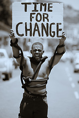 Image showing Protest, city and portrait of a man with a poster against discrimination, racism or equality. Rope, sign and angry guy walking, protesting and shouting to fight for change, human rights or justice.