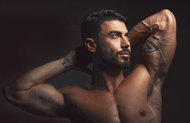 Image showing Man, body or muscle on black background in studio for fitness goals, workout or training motivation and healthcare wellness check. Bodybuilder, sports athlete or model flexing on aesthetic backdrop