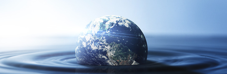 Image showing Water, planet and climate change with the earth in a puddle as a symbol of global warming or temperature shift. Nature, abstract and background with the world in the sea or ocean for sustainability