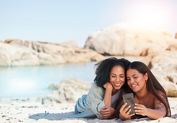Image showing Friends, phone selfie and relax beach travel together for summer holiday, vacation or quality time bonding. Women, smile and happiness for smartphone photography or ocean sea adventure in sunshine