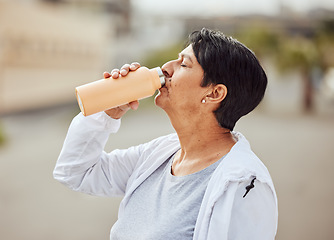Image showing Fitness, runner or old woman drinking water with sports goals resting or relaxing on break. Healthy, tired or thirsty elderly person drinks natural liquid in cardio workout, training or body exercise