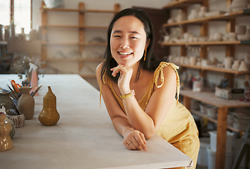 Image showing Asian woman, smile portrait and ceramic art studio for product manufacturing workshop, sculpture artist and creativity retail store. Pottery, artistic woman business and creative artwork happiness