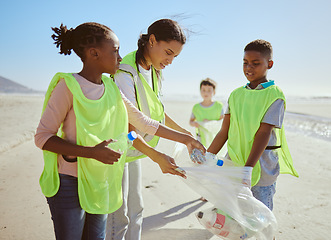 Image showing Children, beach and plastic recycling teamwork for pollution ecology and environmental change collaboration. Eco friendly team, diversity and ocean garbage recycle together for community cleaning