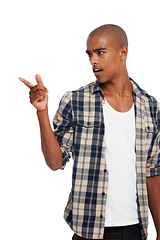 Image showing Fashion, casual and man pointing in studio with a omg, wtf or surprise facial expression. Handsome, young and male model from Brazil with trendy, stylish and cool outfit isolated by white background.