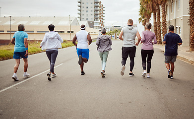 Image showing Fitness, city or people running in a marathon challenge with sports performance goals on urban city street. Back view, healthy runners or senior women in a cardio workout, training or body exercise