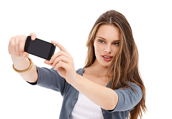 Image showing Mobile phone, studio selfie and woman with cellphone memory picture for social media app, online website or social network. Digital tech user, smartphone photo and model girl pose on white background