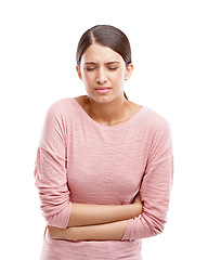 Image showing Studio, constipation and woman stomach pain, sick or digestion problem isolated on white background. Sad, angry and frustrated model endometriosis, gut health or pancreas risk in advertising mockup