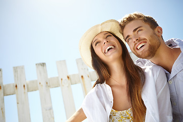 Image showing Love, laugh and blue sky mockup with a couple on a date outdoor for romance or honeymoon travel. Space, summer and dating with a man and woman bonding together outside during holiday or vacation