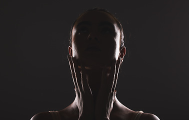 Image showing Woman, beauty and face silhouette in dark fantasy, cosmetics and dream aesthetics. Shadow, black background and model headshot while touching facial skin in mystery, studio background and erotic body