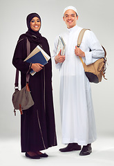 Image showing Portrait, smile and Arabic students with education, knowledge and people isolated on white studio background. Islamic, man and woman in traditional clothes, learning or confident with books and smile