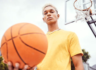 Image showing Sports, basketball court and a portrait of man with ball outside at park. Exercise, motivation and workout for fitness, wellness and health. Street game, outdoor basketball training and serious face.